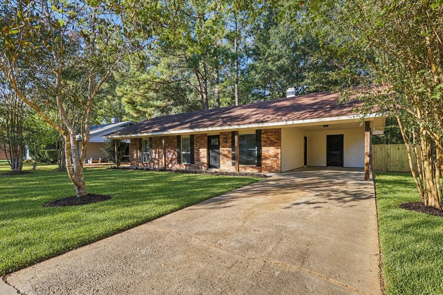 Front exterior and driveway at 2381 Deer Oak Place
