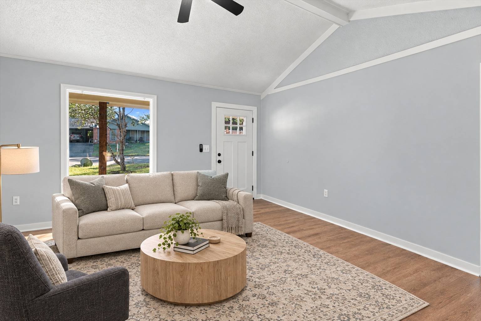 Living room seating area with front window at 2381 Deer Oak Place