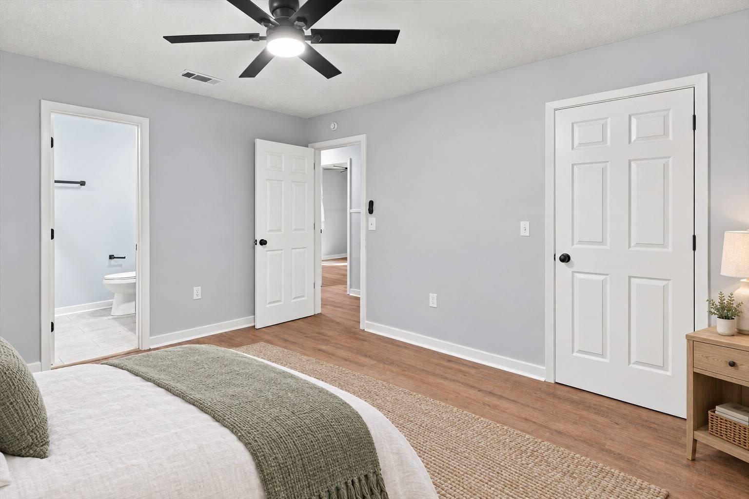 Primary bedroom with en suite bathroom entry at 2381 Deer Oak Place