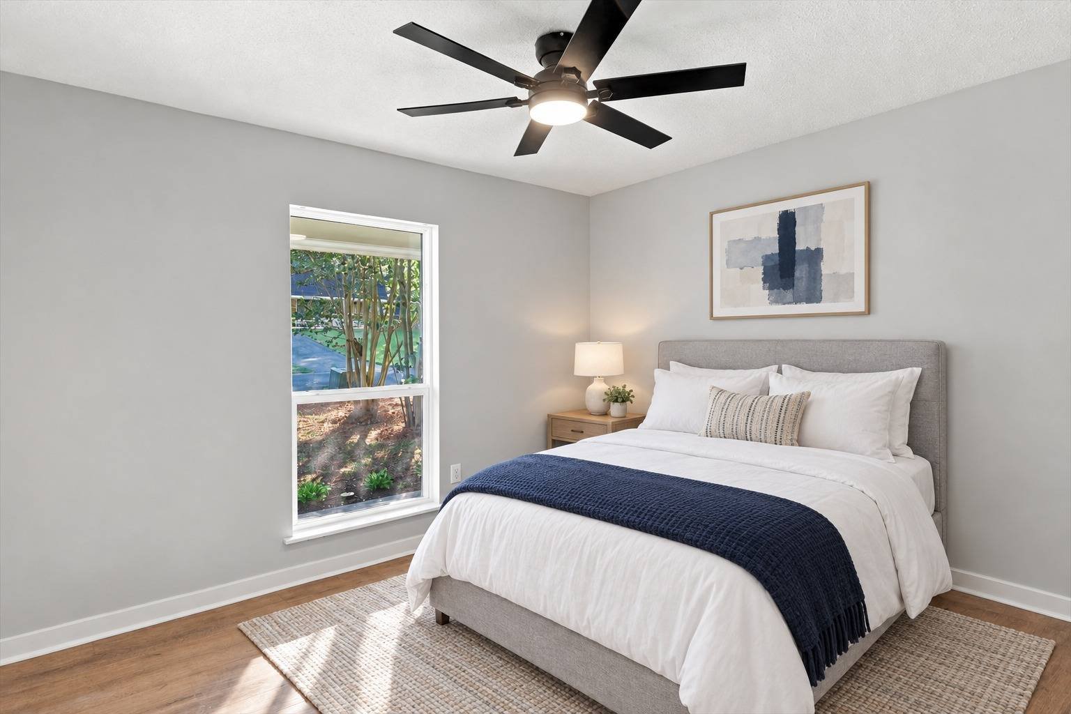 Primary bedroom with window and ceiling fan at 2381 Deer Oak Place