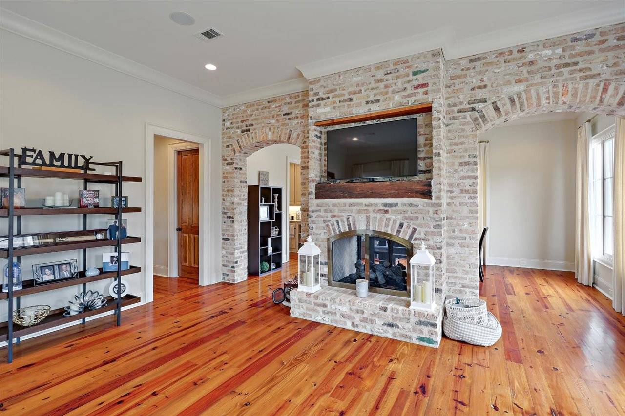 Living area and brick fireplace at 115 Fenwick Circle