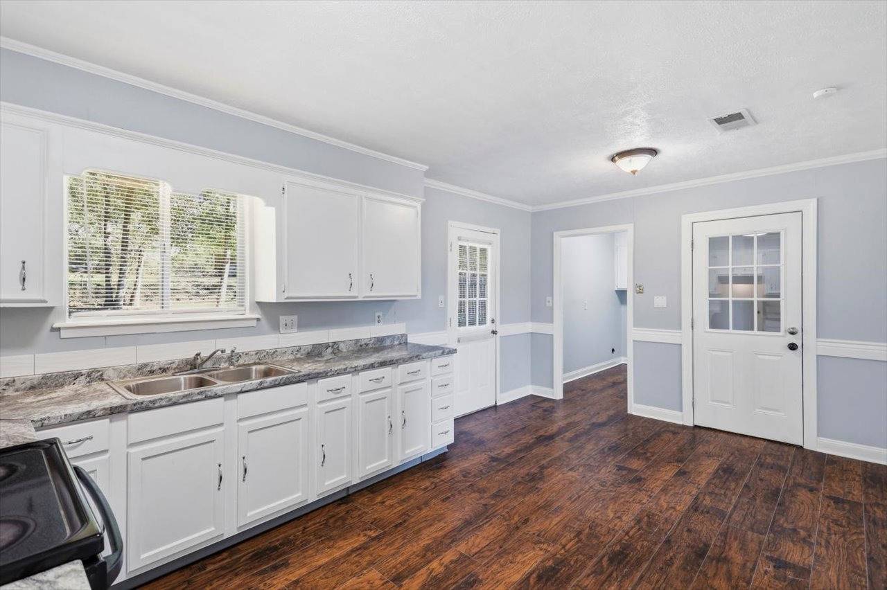 Kitchen with window and side door at 4972 Oak Creek Drive